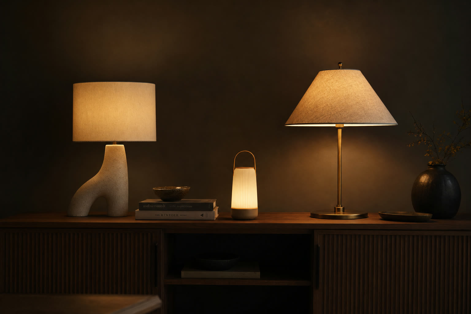 A still-life of three warm cozy lamps on a console at evening